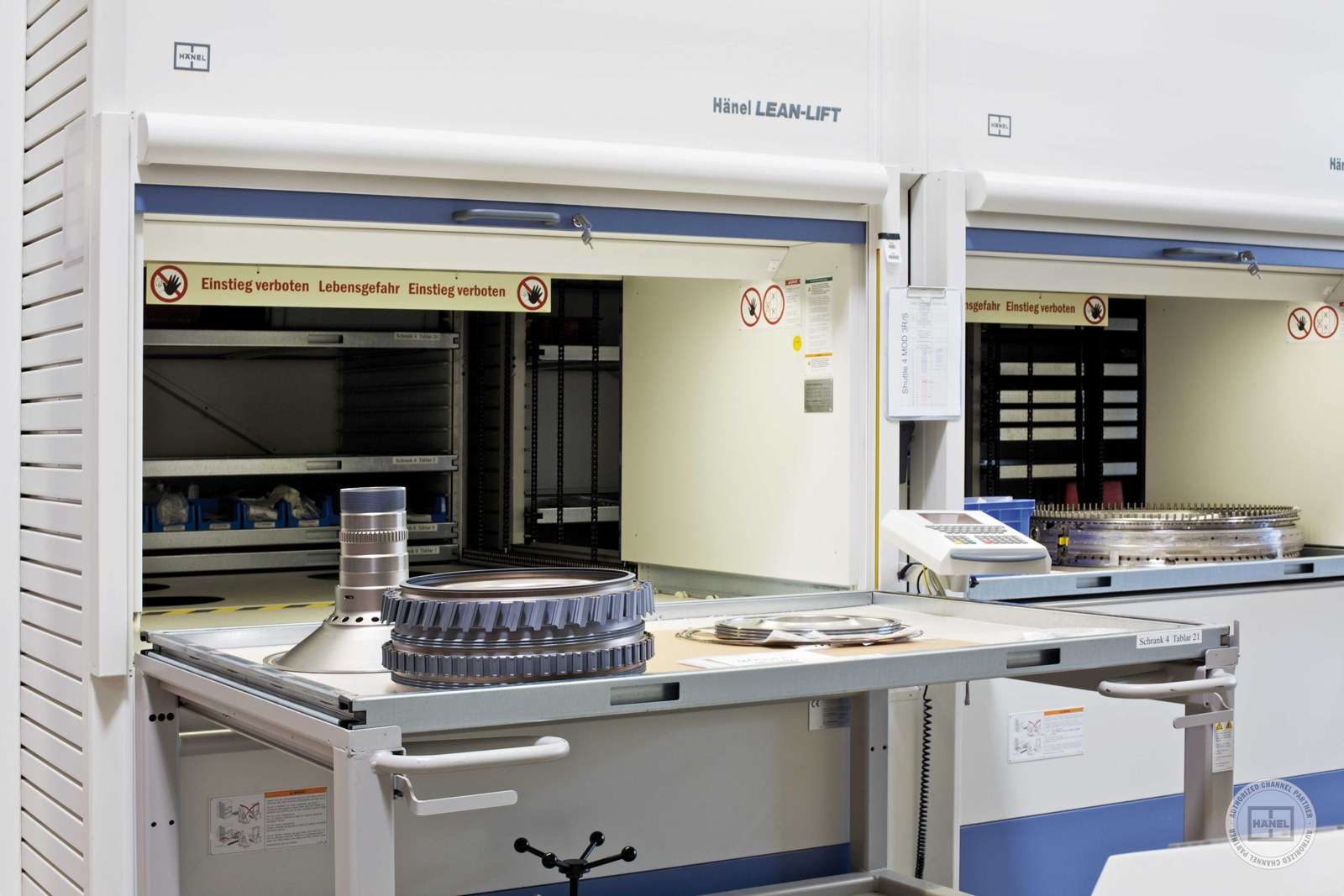 Hänel Lean-Lift access trays holding machined metal parts